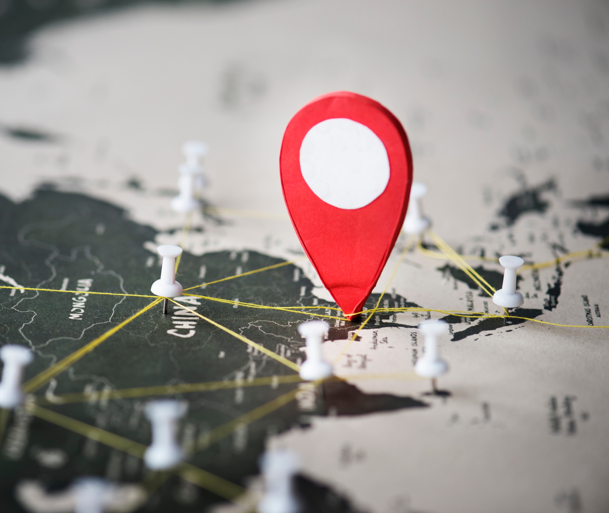 Closeup of pins on world map journey travel