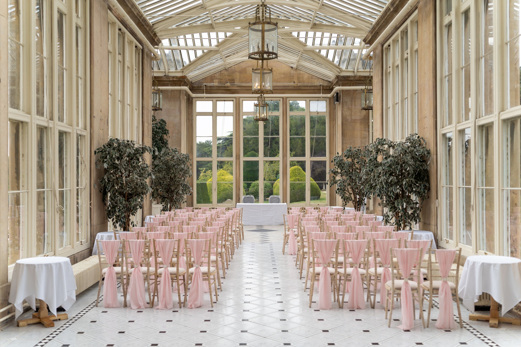 Interior banquet room with elegant tables and chairs arranged in a large open space