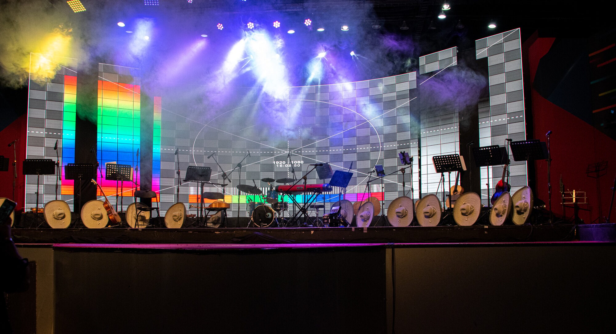 musical stage with lights, hats and instruments ready for performance